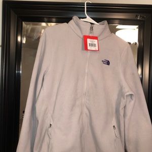 Light purple north face jacket.